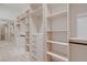 Walk-in closet boasts custom shelving, drawers, and a full-length mirror at 182 Robledo St, Las Vegas, NV 89138