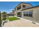 Sunny backyard highlighting the artificial turf, unique landscaping, and outdoor space at 182 Robledo St, Las Vegas, NV 89138