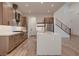 Spacious kitchen with stainless steel appliances, a large island, and hardwood floors at 182 Robledo St, Las Vegas, NV 89138