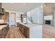 Open concept living room and kitchen with hardwood floors and modern appliances at 182 Robledo St, Las Vegas, NV 89138