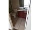 Standard bathroom featuring a vanity with wood cabinets and neutral tile flooring at 206 Valerian St, Henderson, NV 89015