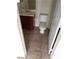 Basic bathroom with a toilet, vanity, and neutral-toned tile flooring at 206 Valerian St, Henderson, NV 89015