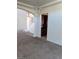 Inviting entryway featuring neutral carpet, chandelier, and staircase leading to the second floor at 206 Valerian St, Henderson, NV 89015