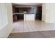 Open-concept kitchen with dark cabinets, tile flooring, and ample counter space at 206 Valerian St, Henderson, NV 89015