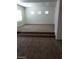Large living room featuring neutral carpet, multiple windows, and recessed lighting at 206 Valerian St, Henderson, NV 89015