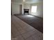 Living room featuring carpeted floors and a built-in fireplace at 206 Valerian St, Henderson, NV 89015