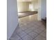 Open living space with tiled flooring transitioning to carpeting at 206 Valerian St, Henderson, NV 89015