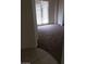 Spacious room with carpet flooring and natural light from the sliding glass door at 206 Valerian St, Henderson, NV 89015