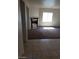 Spacious living room featuring carpeted floors and a modern fireplace at 206 Valerian St, Henderson, NV 89015