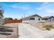 Home featuring a long driveway and a fenced front yard at 2257 Colebrook St, Las Vegas, NV 89115