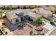 An elevated view of a single-story home with desert landscaping, including a stone-lined planting bed at 2261 Evening Lights St, Henderson, NV 89052