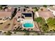 Aerial view of a home featuring a backyard pool, desert landscaping, and solar panels on the roof at 2261 Evening Lights St, Henderson, NV 89052