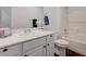 Bright and tidy bathroom with a tub/shower combo, single sink and white cabinets at 2261 Evening Lights St, Henderson, NV 89052