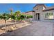 This charming single-story house showcases a stone paved walkway and desert landscaping in front at 2261 Evening Lights St, Henderson, NV 89052