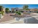 This charming single-story residence features an artfully designed xeriscaped front yard with a two car garage at 2261 Evening Lights St, Henderson, NV 89052