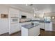 Bright kitchen showcasing white cabinetry, modern appliances, and an island at 2261 Evening Lights St, Henderson, NV 89052