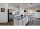 Bright kitchen with island, dining nook, and stainless steel refrigerator at 2261 Evening Lights St, Henderson, NV 89052