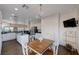 Open concept kitchen and dining area with stainless appliances and an island at 2261 Evening Lights St, Henderson, NV 89052