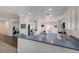 Open kitchen with stainless steel appliances, bar seating, and plenty of counter space at 2261 Evening Lights St, Henderson, NV 89052