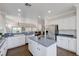 Spacious kitchen featuring an island, stainless steel refrigerator, and open layout at 2261 Evening Lights St, Henderson, NV 89052