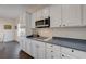 Bright kitchen featuring white cabinetry, modern appliances, and a gas cooktop at 2261 Evening Lights St, Henderson, NV 89052