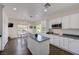 Eat-in kitchen with white cabinets, stainless steel appliances, and center island at 2261 Evening Lights St, Henderson, NV 89052