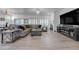 Bright living room boasts a large sectional sofa, a fireplace, and stylish decor throughout at 2261 Evening Lights St, Henderson, NV 89052