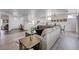 Inviting living room with light wood floors, neutral walls, and an open layout to the kitchen at 2261 Evening Lights St, Henderson, NV 89052