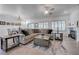 Bright living room boasts a large sectional sofa, a fireplace, and stylish decor throughout at 2261 Evening Lights St, Henderson, NV 89052