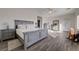 Spacious main bedroom with a bed, dresser, and natural light at 2261 Evening Lights St, Henderson, NV 89052