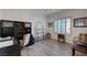 Well-lit office space with modern built-ins, wood floors, and large window at 2261 Evening Lights St, Henderson, NV 89052