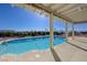 Backyard pool featuring clear water, a concrete deck, and a covered patio with views of the surrounding landscape at 2261 Evening Lights St, Henderson, NV 89052