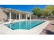 Private backyard pool with a sun-soaked patio, perfect for relaxing and enjoying warm weather gatherings and barbecues at 2261 Evening Lights St, Henderson, NV 89052