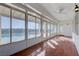 Sunroom with tiled floors, large windows, and access to an outdoor swimming pool at 2261 Evening Lights St, Henderson, NV 89052