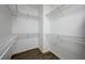 Empty walk-in closet with shelving and wood look floor at 2261 Evening Lights St, Henderson, NV 89052