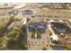 Aerial view of a sprawling home featuring a vineyard, desert landscaping, and mountain views at 2261 Pampa Ave, Pahrump, NV 89048