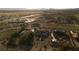 Aerial view of a property with desert landscaping, vineyard, and distant mountain views at 2261 Pampa Ave, Pahrump, NV 89048