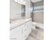 Bathroom featuring double vanity, white cabinets, gray granite counters, and shower at 2261 Pampa Ave, Pahrump, NV 89048