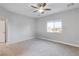 Bedroom with neutral carpet and a window overlooking desert neighborhood at 2261 Pampa Ave, Pahrump, NV 89048