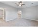 Large bedroom with neutral walls, carpet, and ceiling fan at 2261 Pampa Ave, Pahrump, NV 89048