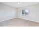 Bedroom with natural light, neutral walls, and carpet at 2261 Pampa Ave, Pahrump, NV 89048