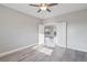 Bright bedroom with light gray wood floors and view into living area at 2261 Pampa Ave, Pahrump, NV 89048