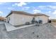 Home exterior featuring a neutral stucco finish, a walkway, and outdoor cooking appliances at 2261 Pampa Ave, Pahrump, NV 89048
