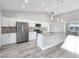 Modern kitchen with white cabinets, stainless steel appliances, and a granite island at 2261 Pampa Ave, Pahrump, NV 89048