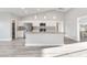 Spacious kitchen with an island, stainless steel appliances, and wood look flooring at 2261 Pampa Ave, Pahrump, NV 89048
