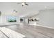 Open-concept space featuring a living room, kitchen and views of the backyard at 2261 Pampa Ave, Pahrump, NV 89048