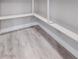 Pantry with wood look flooring and white shelving at 2261 Pampa Ave, Pahrump, NV 89048