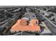 Monochrome aerial of a home with landscaped yard and terracotta tile roof standing out in full color at 2365 Black River Falls Dr, Henderson, NV 89044