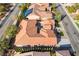 Aerial view of a home showcasing a red tile roof and meticulously landscaped yard at 2365 Black River Falls Dr, Henderson, NV 89044