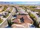 Neighborhood aerial features the house showcasing a desert community, terracotta tile roof, and landscaped yard at 2365 Black River Falls Dr, Henderson, NV 89044